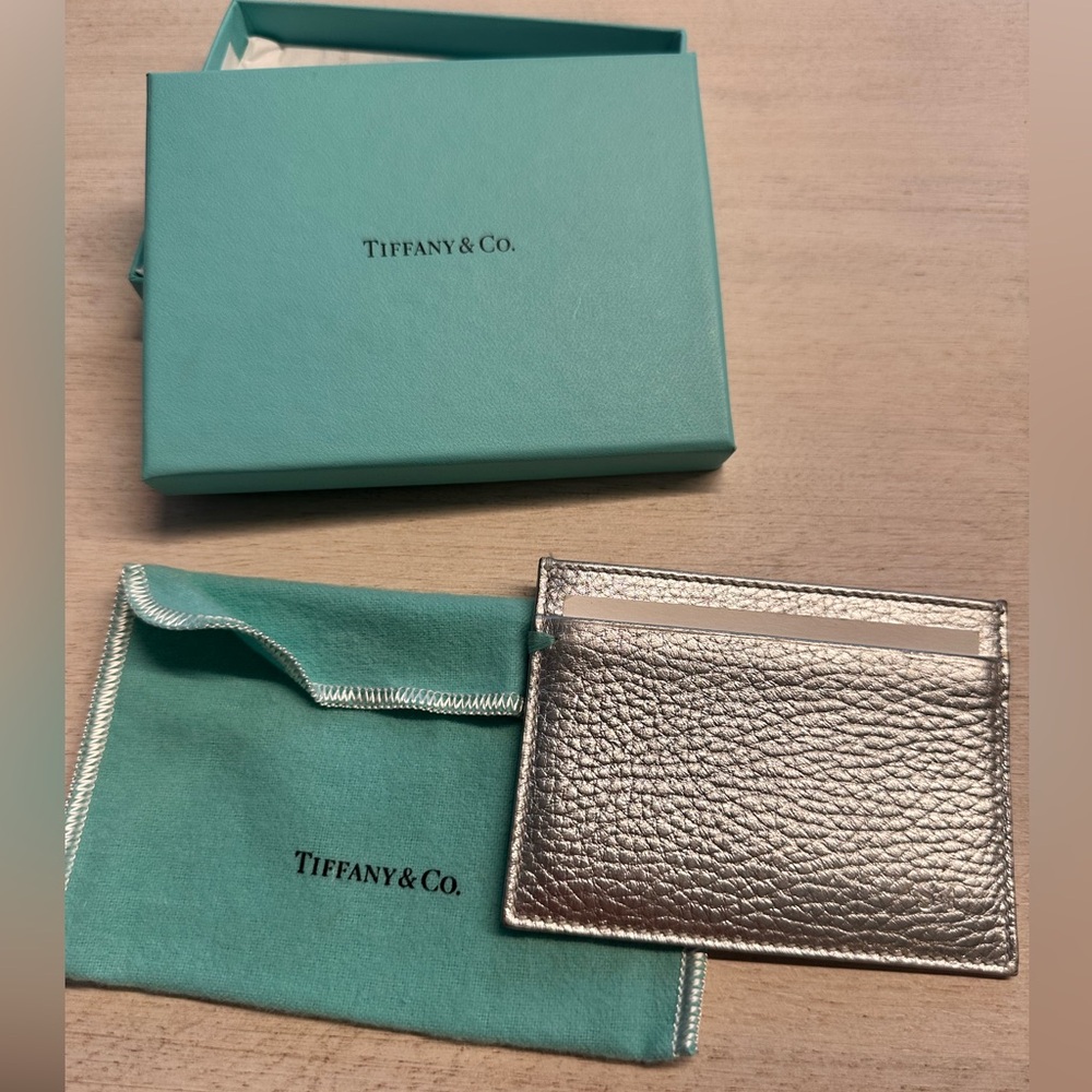 Never used. Tiffany credit card holder. Includes pouch and box.